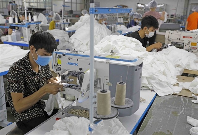 With a positive economic outlook and future opportunities, Vietnamese industries hope to reach ambitious export goals next year. — VNA/VNS Photo Trần Việt