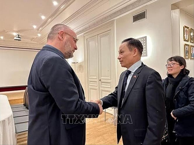 Party official works with National Secretary of French Socialist Party for International Relations